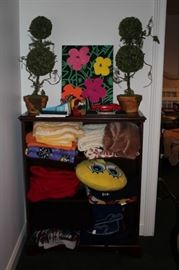 Shelf Unit with Bric-A-Brac and Towels