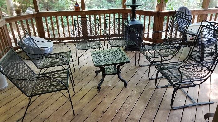 $150.00 iron patio set table and 4 stationary and two rocking chairs.