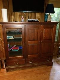 Entertainment cabinet with glass door on left side    $150