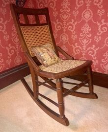 Vintage oak rocker with caned seat and back