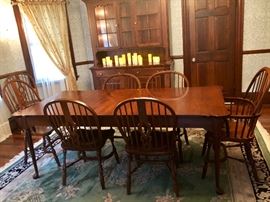 Pennsylvania House Solid Cherry Dining Table with clipped corners: 60" but e expandable with 2 -20" leaves. Includes pads. Table is in perfect condition! 