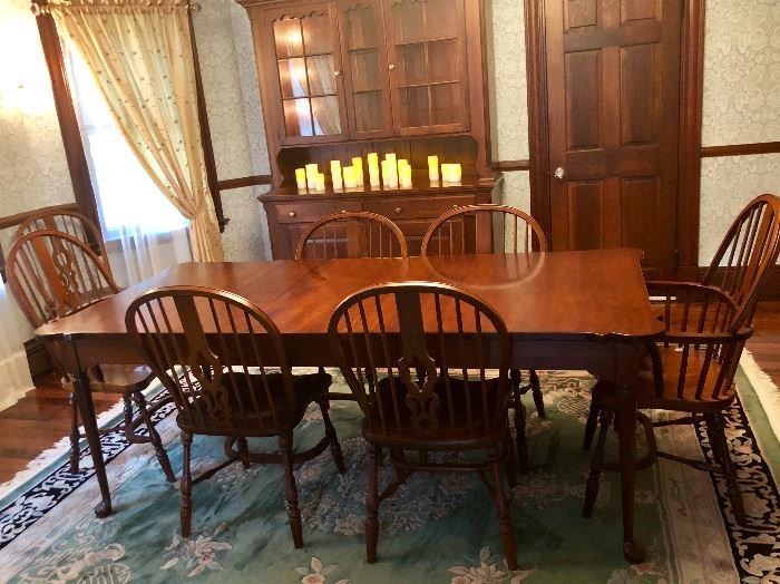 Pennsylvania House Solid Cherry Dining Table with clipped corners: 60" but e expandable with 2 -20" leaves. Includes pads. Table is in perfect condition! 