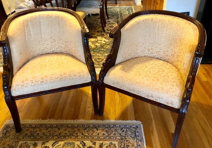 Pair of  vintage barrel-back upholstered armchairs