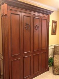 A fabulous Murphy bed! It is a fold-down bed that is  is hinged at one end to store vertically against the wall.
