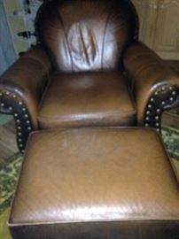 Very comfortable brown leather chair (accented with nail-heads) and ottoman  