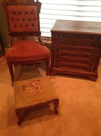 Antique parlor chair; needlepoint foot stool; another antique spool cabinet