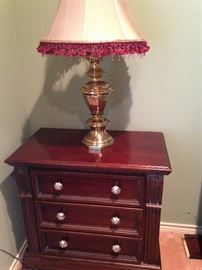 One of two nightstands and lamps