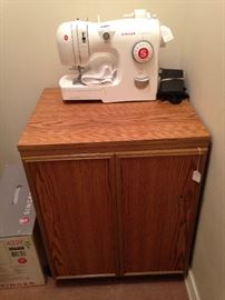 Singer portable sewing machine and cabinet