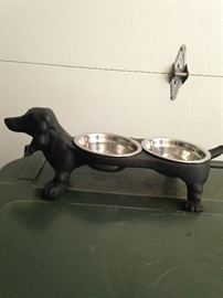 Dachshund feeder  (The standard size dachshund was developed to scent, chase, and flush out badgers and other burrow-dwelling animals.)
