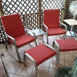 Two of the six reclinable patio chairs have ottomans