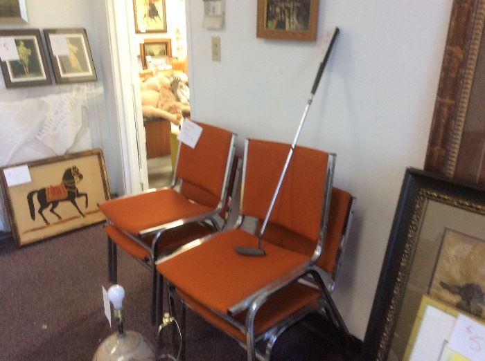 Orange office chairs, ping putter