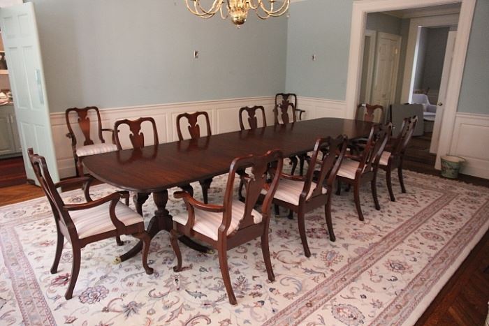 Henkel-Harris  dining room table with 12 armchair dining chairs (we have additional armchairs).  The table as pictured measures 12' 7".  Can be shortened by at least 2', and with additional leaves can be extended 2'.  