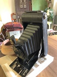 Picture this fun antique camera on your mantel