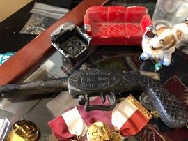 An old cast iron American Bull Dog Boot Jack and some Tootsie Toy Minitures 