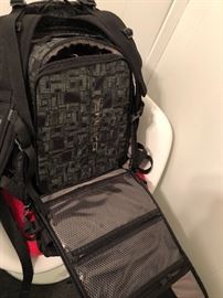 Dakine Photographers backpack with multiple sections for lenses and cameras 