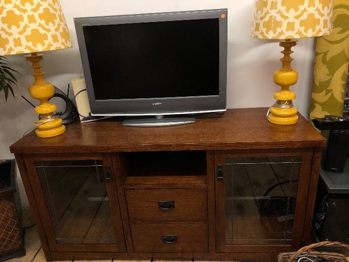 And a larger TV and electronics solid wood with glass doors