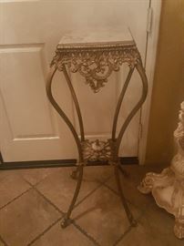 Antique metal table with marble top and bottom