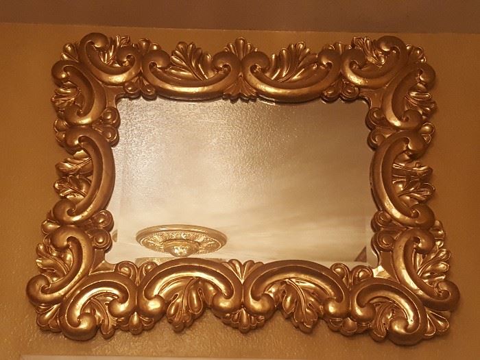 Carved mirror in Wood gold color