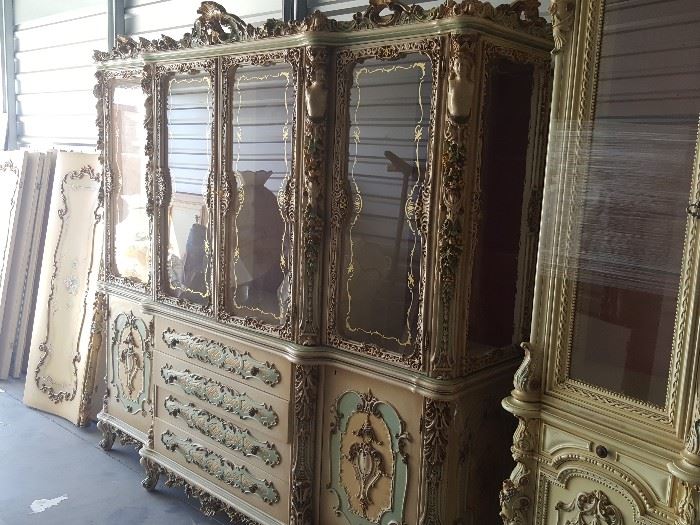 Antique Italian china cabinet with statues carved in it