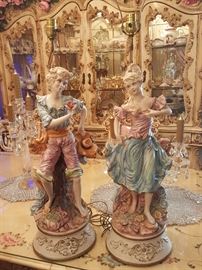 Two statues male and female Italian porcelain