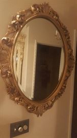 Oval wood framed mirror carved