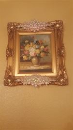 Floral oil painting with decorative frame and gold