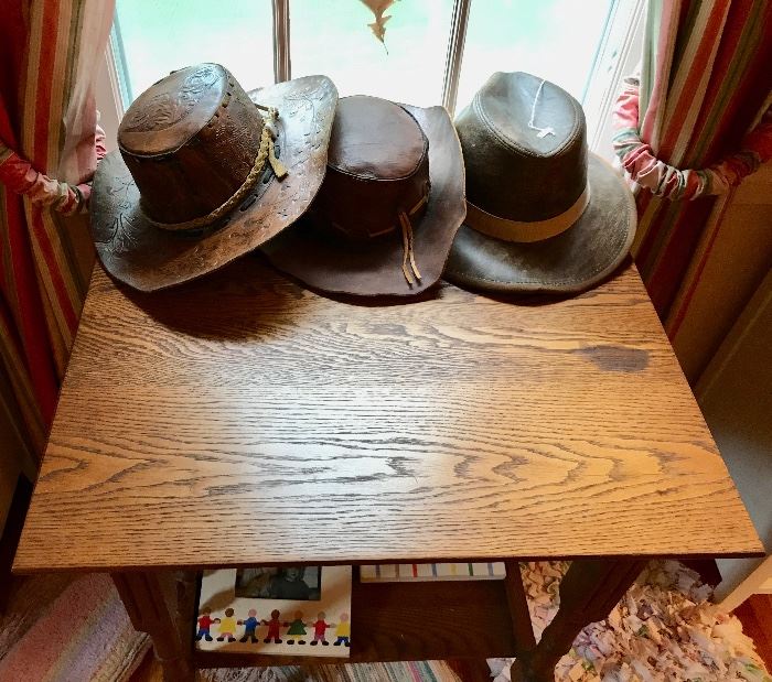 Vintage Leather Hats and Oak Table