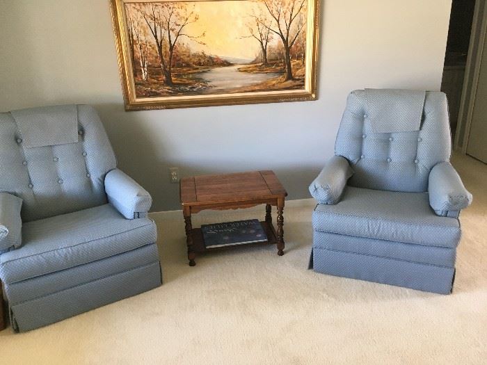 matching upholstered chairs with a nice end table 