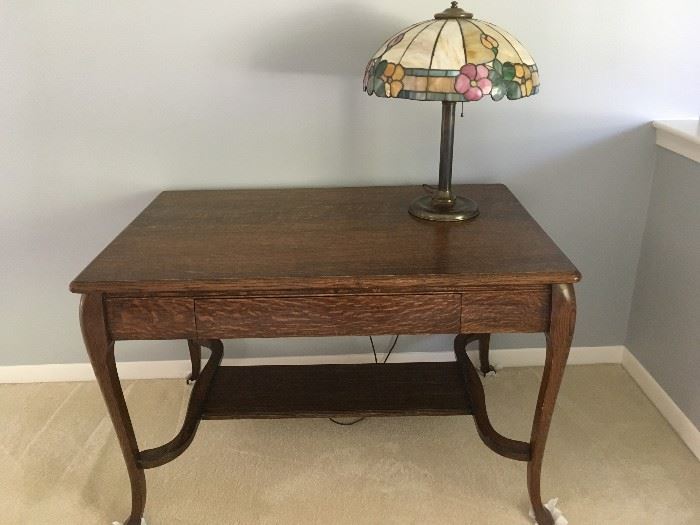This is a beautiful early 1900's oak library table with tiffany-style lamp -- a great piece!