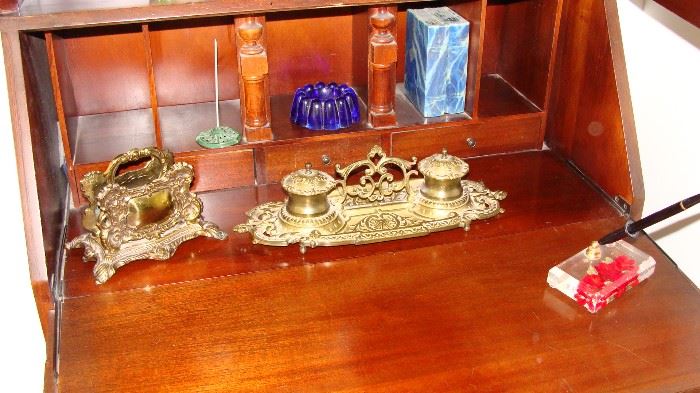 Brass ink well and letter holder.
