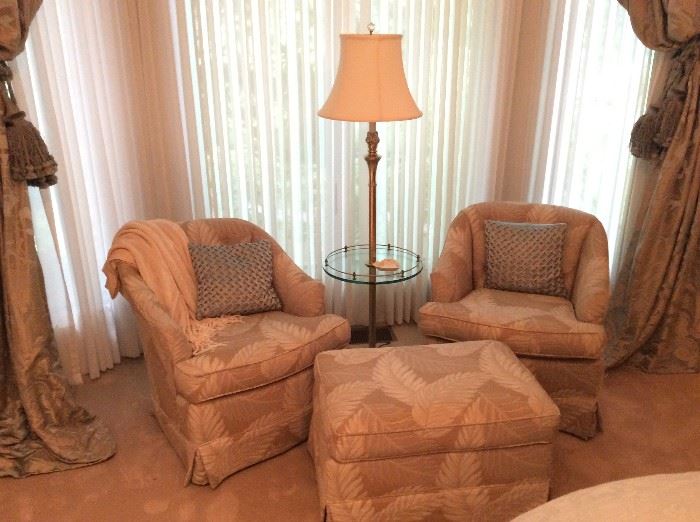 Pair of club chairs, ottoman, floor lamp and other items for sale in the master bedroom.