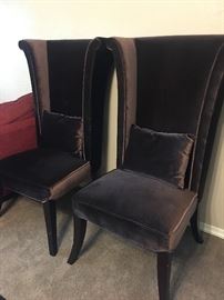 Two Mad Hatter chocolate brown chairs. 