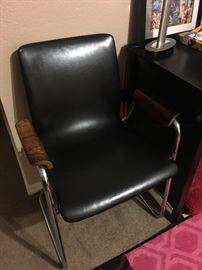 Great leather chair with wood arm rest accent!