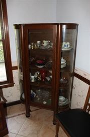 Curved glass China cabinet from early 1900s