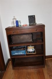small bookcase with drawer above