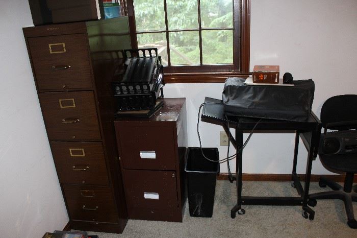 Filing cabinets; typing table in metal; IBM selectric typewriter; secretarial chair