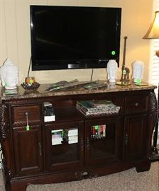Beautiful cabinet with marble top and lots of storage.