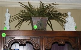 More silk arrangements, and oriental statues.