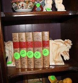 More books and a beautiful pair of marble horse heads for bookends.