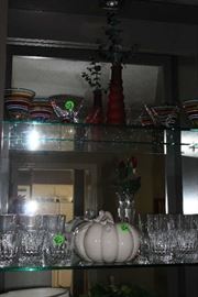 Some of the beautiful items in the cabinets in dining room.  The top half of cabinets have glass shelves and then they have doors on the bottom with shelves.