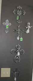 The silver crosses hanging in the breakfast room.