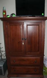 The entertainment in the master bedroom with a flat screen TV.