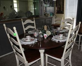 The oval table with 6 chairs in dining room.  