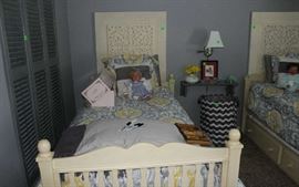 One with the view of the 2 wall hangings above bed and the Middleton dolls.
