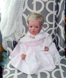 You think she will talk or read to you. She has her little Bible in her hands.