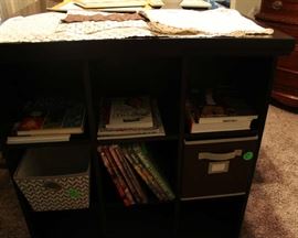 The shelves on the side of the work table.  Has them on each side of table.