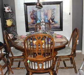 View of the old table and chairs in breakfast room.  Has metal corner cabinet with wood shelves.