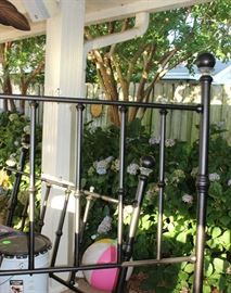 Oil rubbed metal bed.  Has rails, no mattress and box springs.  Has crystal balls around top and center.