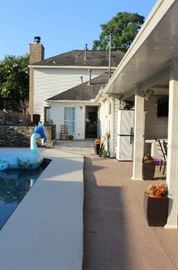 The side of the pergola going into the breakfast room.  This is one yard that looks like paradise.  It was built and designed by Mr. Pool.  A marvelous job well done.