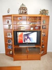 Made of Teak wood, this four piece shelf and entertainment  piece is in beautiful condition, made by ScanDesigns